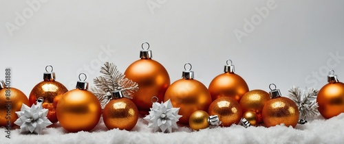 orange christmas decorations on plain white background for banner with copy space