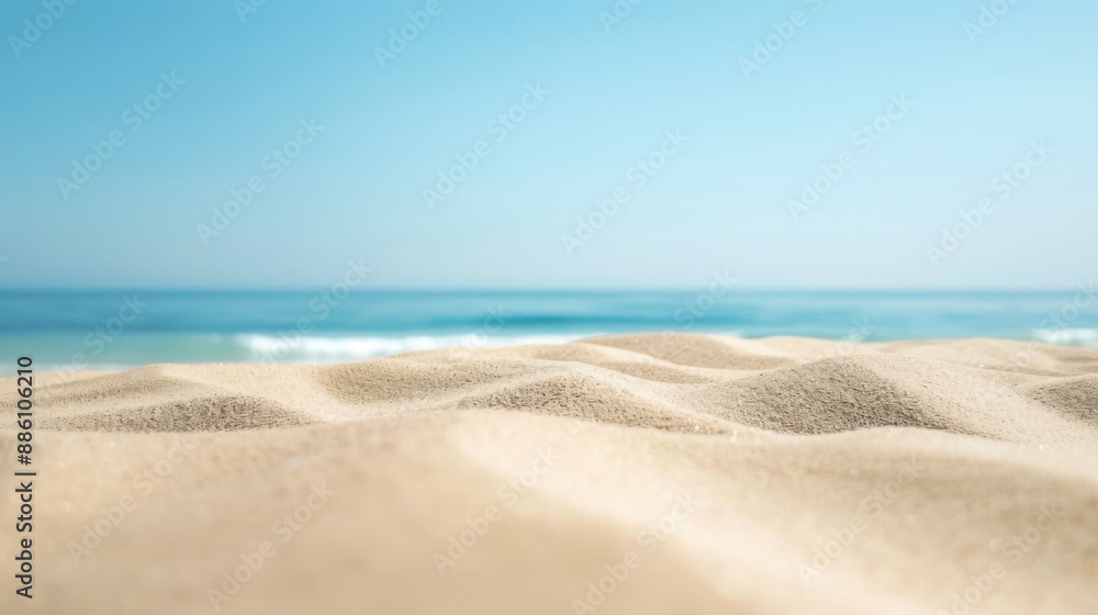 Close-up beach scene under blue sky with white clouds, featuring sand and sea horizon Close-up beach scene under blue sky with white clouds, featuring sand and sea horizon