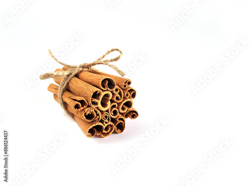 Closeup of cinnamon sticks on white background