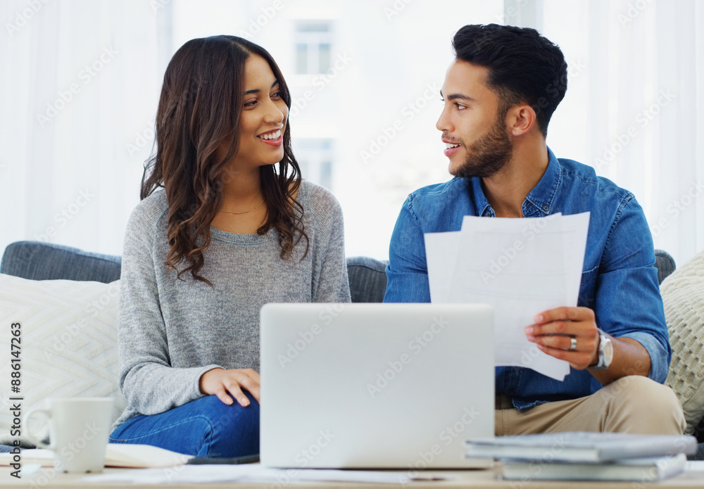 Documents, laptop and taxes with couple on sofa in living room of home for bank payment. Accounting, computer or finance with man and woman in apartment to review insurance or mortgage paperwork Documents, laptop and taxes with couple on sofa in living room of home for bank payment. Accounting, computer or finance with man and woman in apartment to review insurance or mortgage paperwork