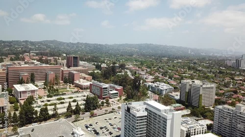 Los Angeles, California Aerial View with the Hollywood Hills and Beverly Hills in the Background on a Warm Sunny Day. Westwood and Willshire Boulevard. photo