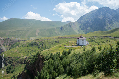 Mountain landscape with a house in the distance