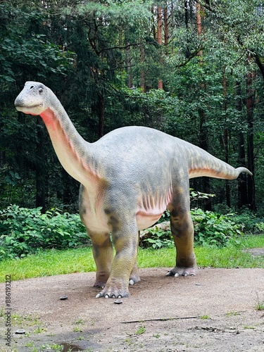 Vulcanodon dinosaur. Realistic figure of the Vulcanodon dinosaur in the forest in Kazimierz, Sosnowiec. The park setting highlights the dinosaur in its natural environment. photo