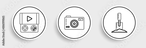 Set line Shovel in the ground, Portable video game console and Photo camera icon. Vector