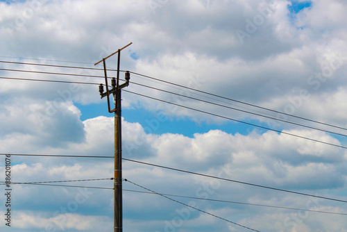 Wallpaper Mural Blue sky with clouds and mountains blocked by electric poles  Torontodigital.ca