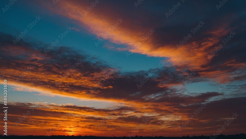 Sunset sky transitioning from blue to orange in a stunning gradient Sunset sky transitioning from blue to orange in a stunning gradient