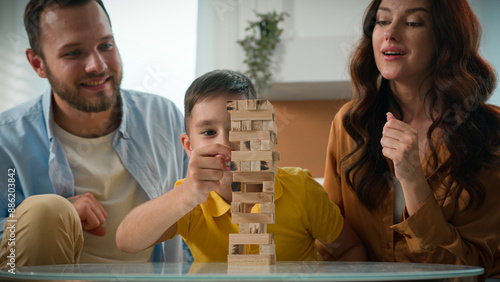 Foto Happy cheerful Caucasian family spending time together at home mother father son
