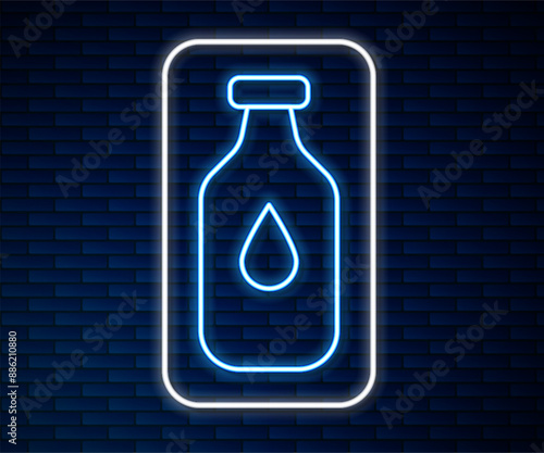 Glowing neon line Bottle of water icon isolated on brick wall background. Soda aqua drink sign. Vector