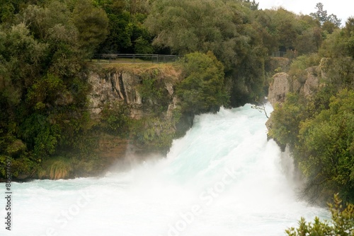 Water rages wildly in the river, The Huka Falls, Waikato River photo