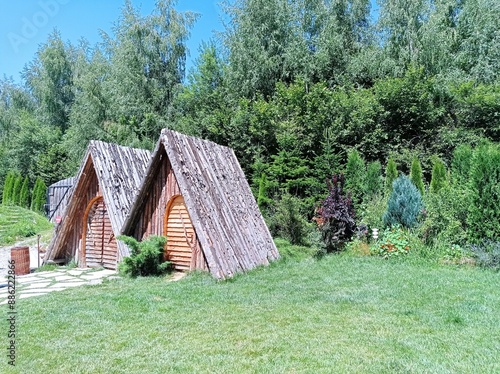 Rustic Wooden Cabins in Green Garden