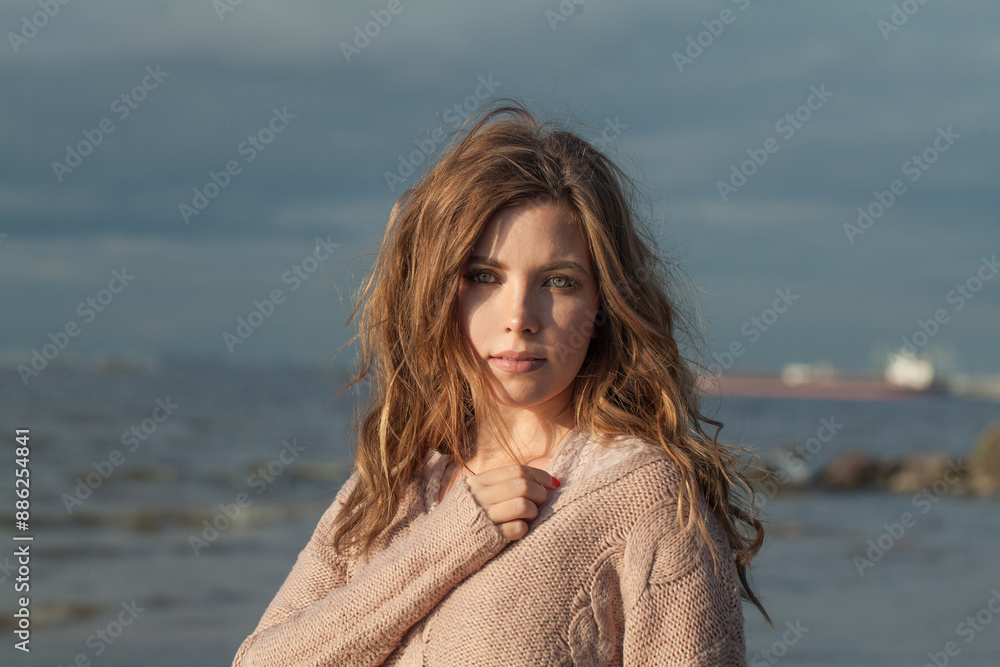 Brunette young adult female model with windy brown hair walking outdoor Brunette young adult female model with windy brown hair walking outdoor