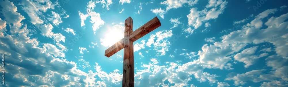 Wooden Cross Against Bright Blue Sky with Clouds Wooden Cross Against Bright Blue Sky with Clouds
