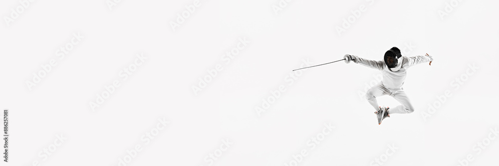 Banner. Fencer in uniform and mask in impressive leap, holding rapier forward against white studio background with negative space. Concept of professional sport, competition, achievement. Ad Banner. Fencer in uniform and mask in impressive leap, holding rapier forward against white studio background with negative space. Concept of professional sport, competition, achievement. Ad
