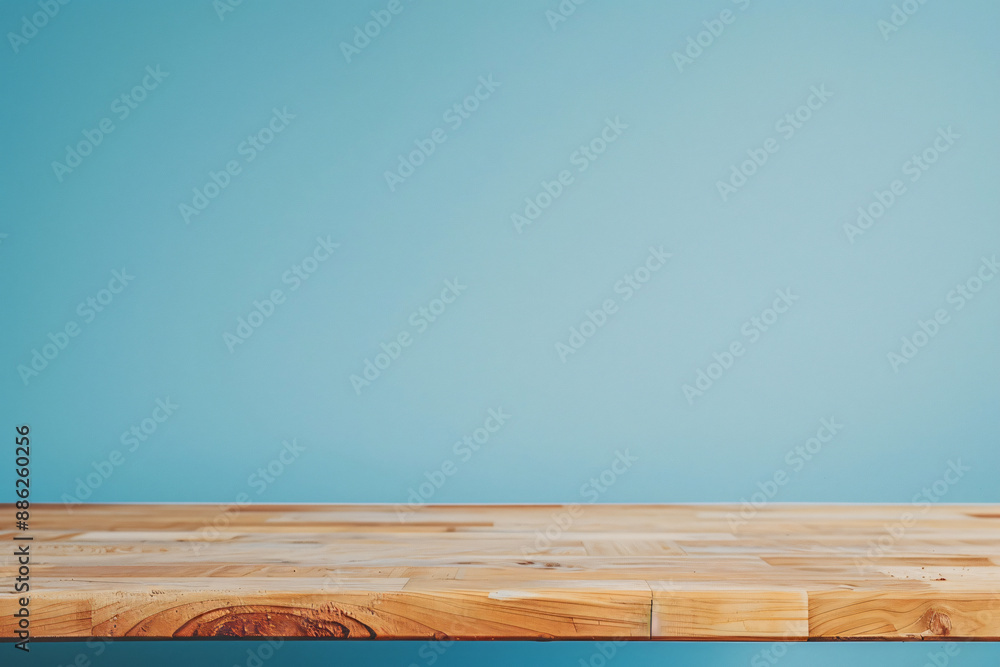 Wooden table top with a pastel blue background for a product display presentation concept, an empty and clean wood board on a color wall minimalism background Wooden table top with a pastel blue background for a product display presentation concept, an empty and clean wood board on a color wall minimalism background