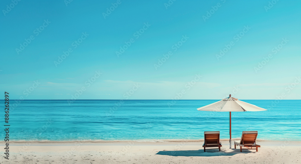 Obraz premium beach with umbrella and chairs