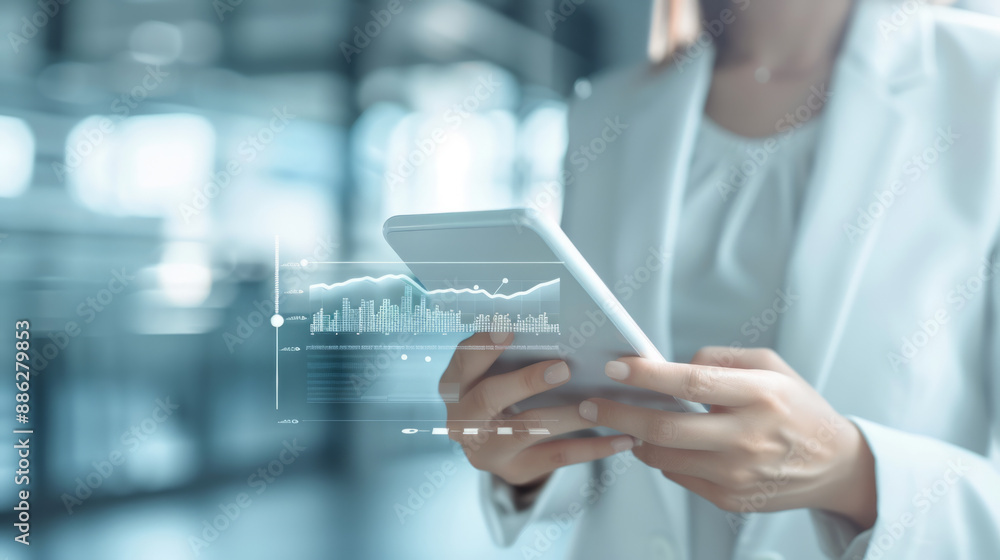 Businesswoman using smart device in interactive office setting with modern technology. Businesswoman using smart device in interactive office setting with modern technology.