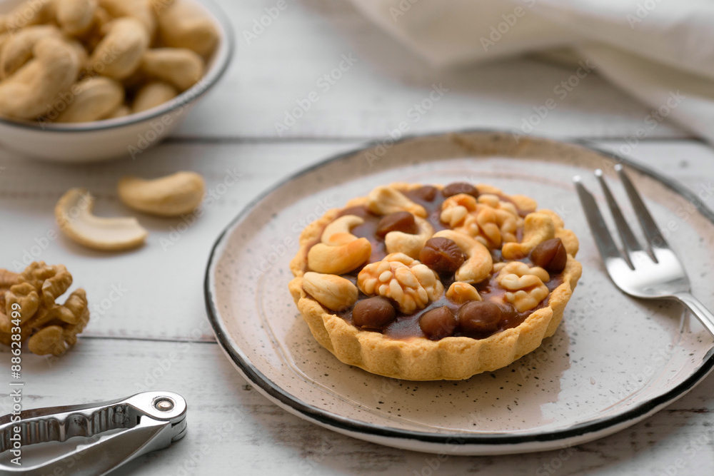 Cake with shortcake dough and nuts. Dessert in a basket with walnut filling, walnuts, hazelnuts and cashews Cake with shortcake dough and nuts. Dessert in a basket with walnut filling, walnuts, hazelnuts and cashews