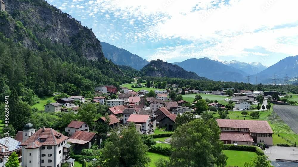 Scenic aerial view of Rothenbrunnen, Switzerland with lush greenery and quaint buildings Scenic aerial view of Rothenbrunnen, Switzerland with lush greenery and quaint buildings