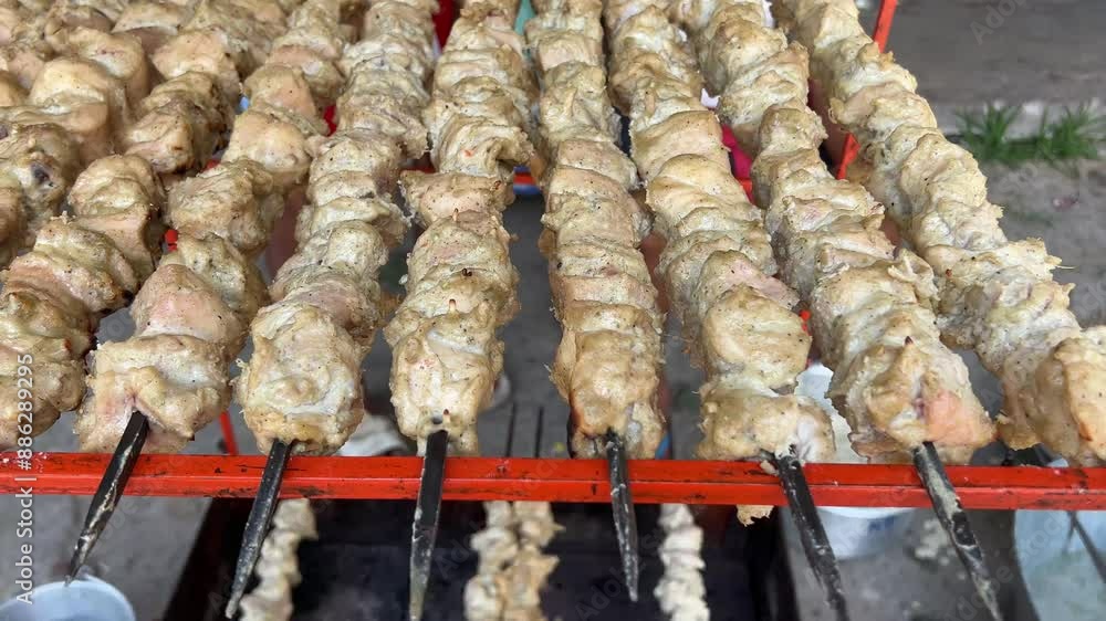 Closeup shot of multiple marinated kebabs in skewers ready for roasting. Closeup shot of multiple marinated kebabs in skewers ready for roasting.