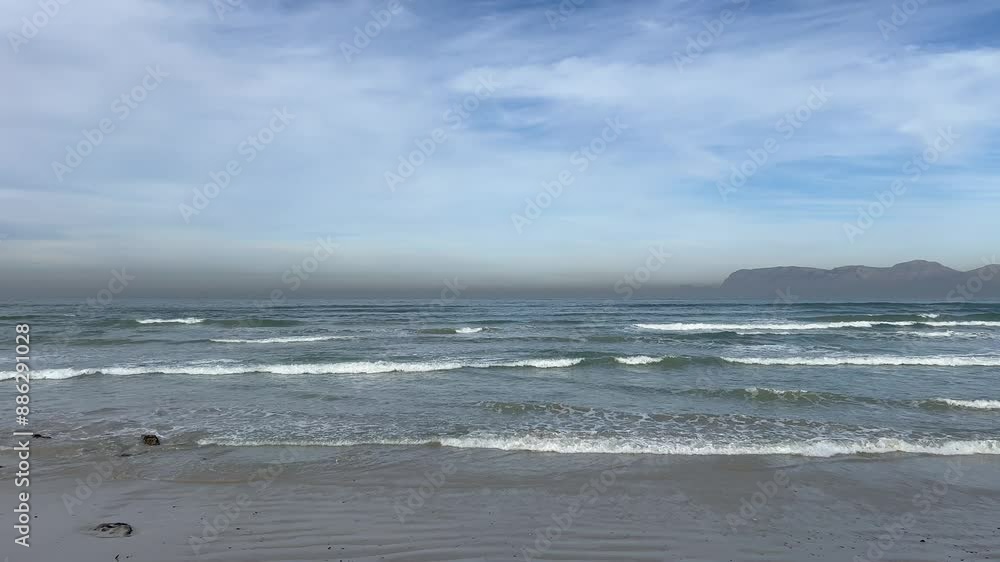 Tide coming in by the beach with views of the Cape Peninsula Tide coming in by the beach with views of the Cape Peninsula