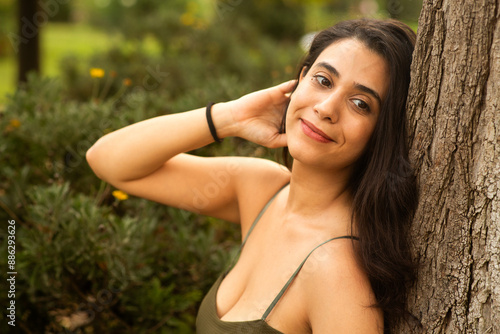 woman relaxing in the park with beautiful smile