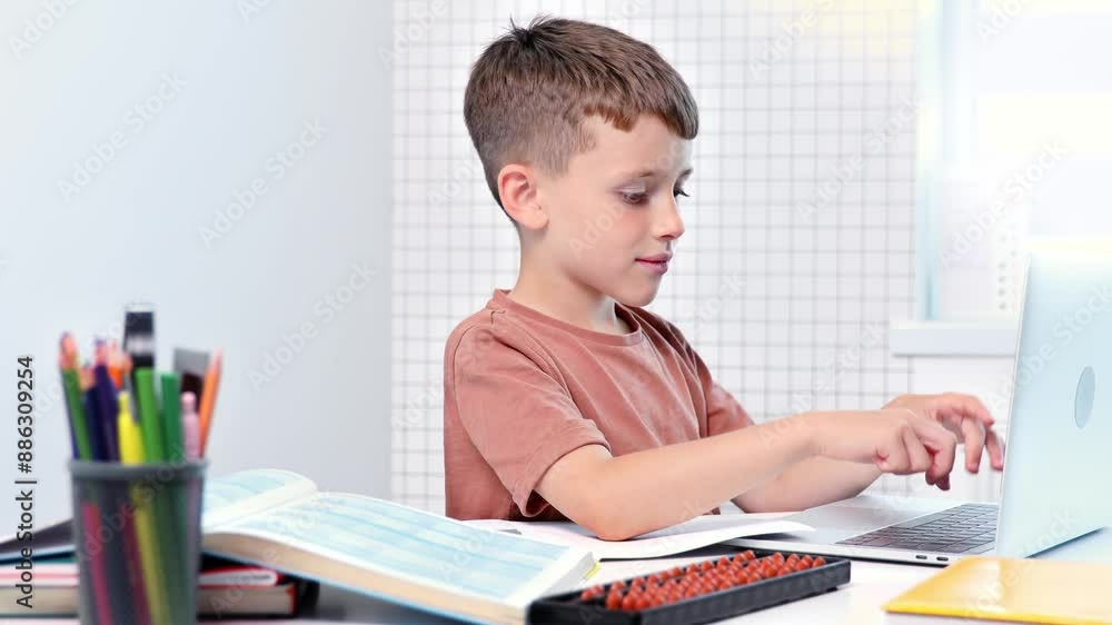 Little boy using laptop for homework. Distance education Little boy using laptop for homework. Distance education