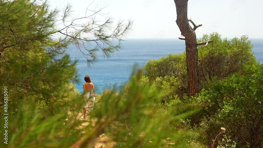 A girl enters a gazebo on the seashore A girl enters a gazebo on the seashore