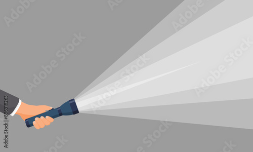 Businessman hand holding flashlight