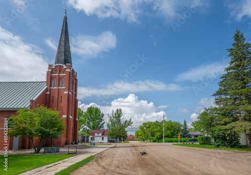 Red brick Catholic church on a street in the village of Sedley, Saskatchewan, Canada photo