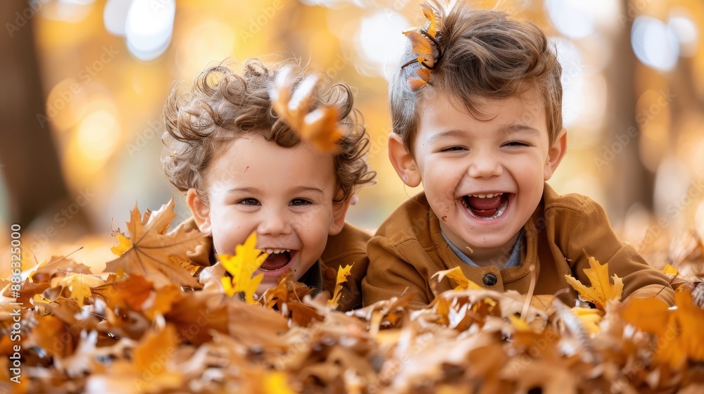 Two smiling kids lie in a pile of autumn leaves, their laughter encapsulating the spirit of fall, playfulness, and the simple joys of an outdoor adventure. Two smiling kids lie in a pile of autumn leaves, their laughter encapsulating the spirit of fall, playfulness, and the simple joys of an outdoor adventure.