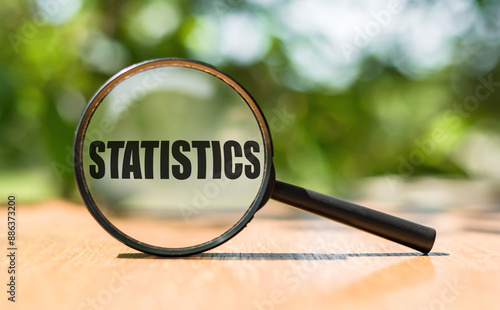 Magnifying Glass Focused on the Word Statistics on a Bright Day