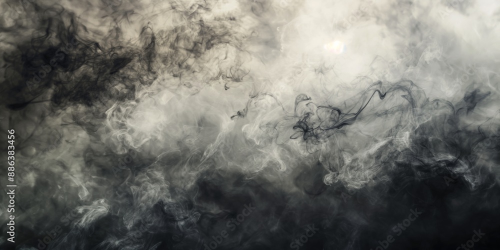 A black and white photo of smoke with a grayish color. The smoke is thick and dark, giving the image a moody and ominous feel A black and white photo of smoke with a grayish color. The smoke is thick and dark, giving the image a moody and ominous feel