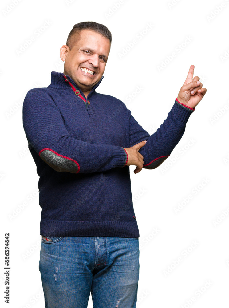 Middle age arab man over isolated background with a big smile on face, pointing with hand and finger to the side looking at the camera. Middle age arab man over isolated background with a big smile on face, pointing with hand and finger to the side looking at the camera.