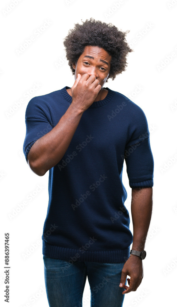 Afro american man over isolated background looking stressed and nervous with hands on mouth biting nails. Anxiety problem. Afro american man over isolated background looking stressed and nervous with hands on mouth biting nails. Anxiety problem.