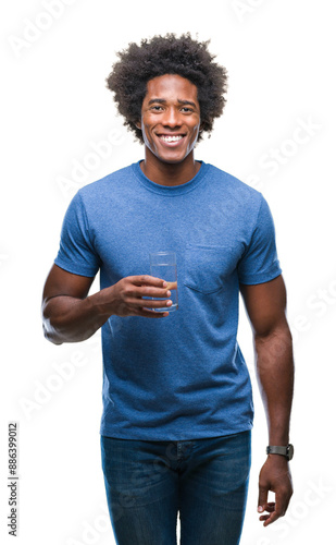 Afro american man drinking glass of water over isolated background with a happy face standing and smiling with a confident smile showing teeth