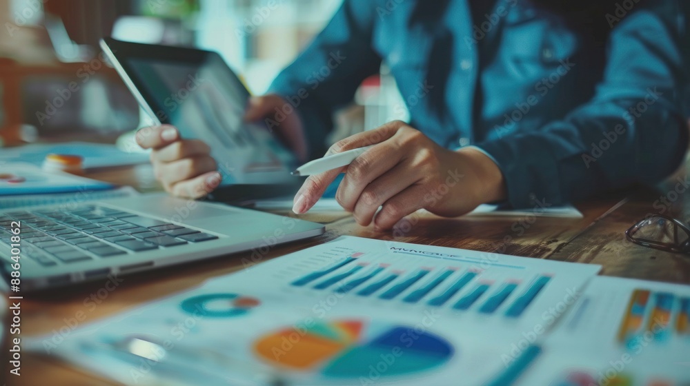 Businesswoman Analyzing Financial Data on Tablet Businesswoman Analyzing Financial Data on Tablet