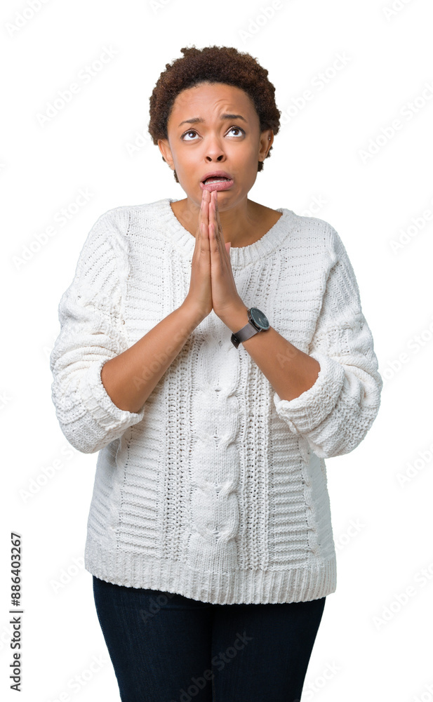 Beautiful young african american woman wearing sweater over isolated background begging and praying with hands together with hope expression on face very emotional and worried. Asking for forgiveness