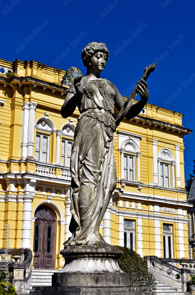 Decorative sculpture with yellow facade in the background, Petropolis, Rio de Janeiro, Brazil Decorative sculpture with yellow facade in the background, Petropolis, Rio de Janeiro, Brazil