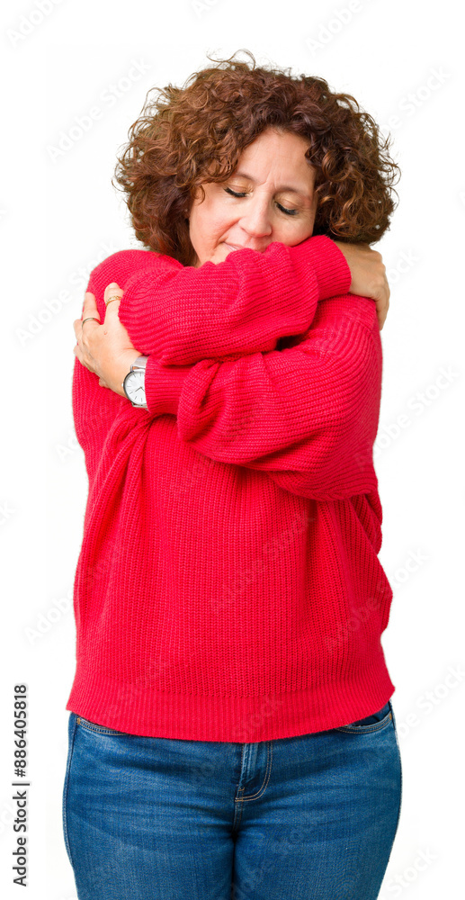 Beautiful middle ager senior woman red winter sweater over isolated background Hugging oneself happy and positive, smiling confident. Self love and self care Beautiful middle ager senior woman red winter sweater over isolated background Hugging oneself happy and positive, smiling confident. Self love and self care
