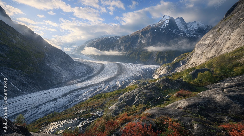 An image of a glacier rapidly melting into a valley, showing the direct consequences of rising global temperatures. An image of a glacier rapidly melting into a valley, showing the direct consequences of rising global temperatures.
