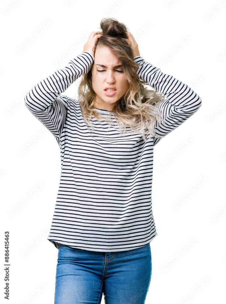 Beautiful young blonde woman wearing stripes sweater over isolated background suffering from headache desperate and stressed because pain and migraine. Hands on head. Beautiful young blonde woman wearing stripes sweater over isolated background suffering from headache desperate and stressed because pain and migraine. Hands on head.