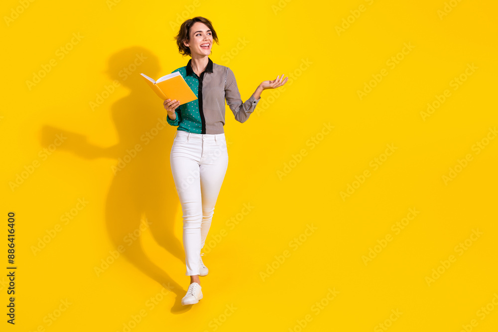 Full length photo of lovely adorable cheerful woman wear trendy clothes look empty space isolated on yellow color background Full length photo of lovely adorable cheerful woman wear trendy clothes look empty space isolated on yellow color background