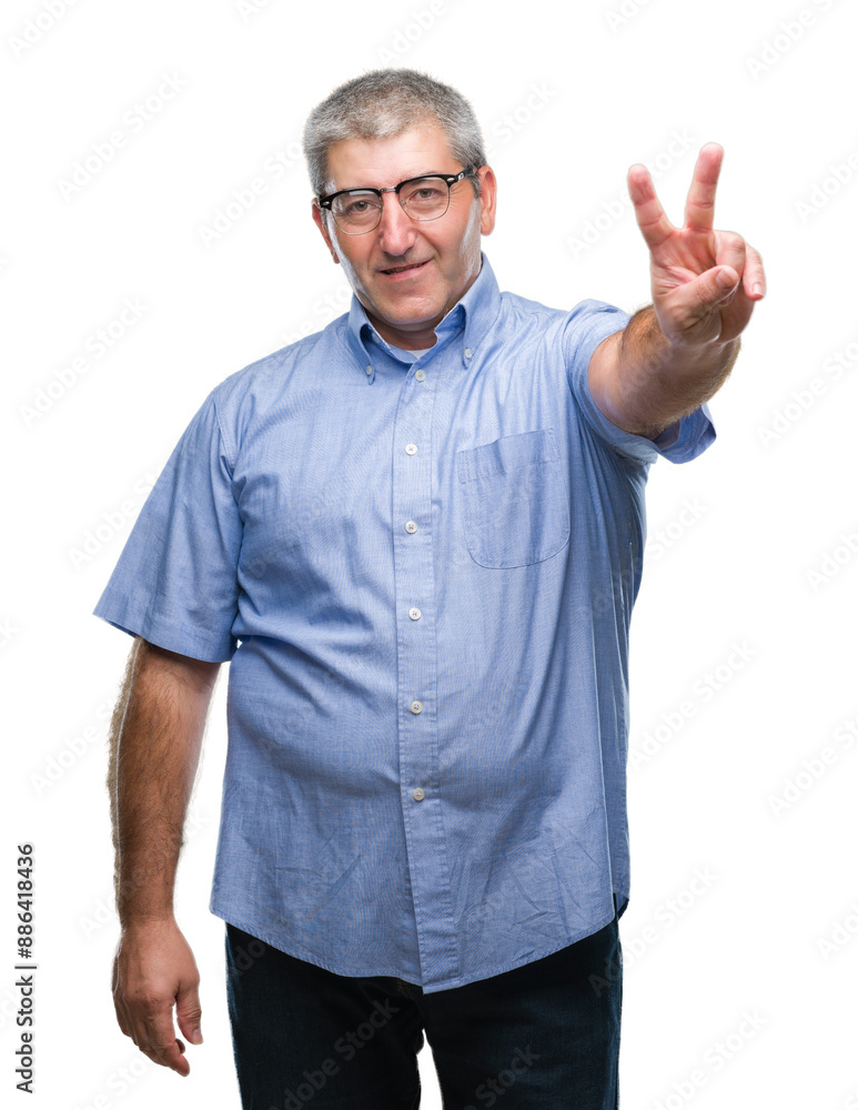 Naklejka premium Handsome senior man wearing glasses over isolated background smiling with happy face winking at the camera doing victory sign. Number two.