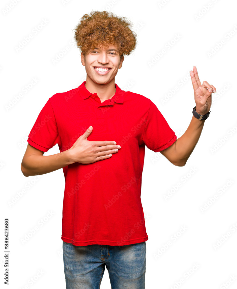 Young handsome man with afro hair wearing red t-shirt Swearing with hand on chest and fingers, making a loyalty promise oath Young handsome man with afro hair wearing red t-shirt Swearing with hand on chest and fingers, making a loyalty promise oath