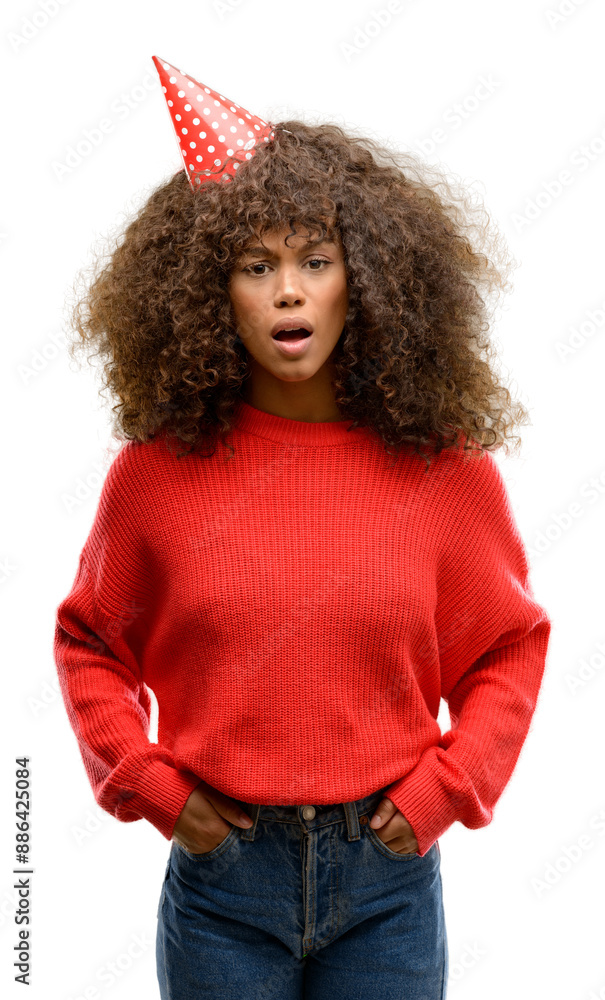 African american woman celebrates birthday scared in shock with a surprise face, afraid and excited with fear expression African american woman celebrates birthday scared in shock with a surprise face, afraid and excited with fear expression