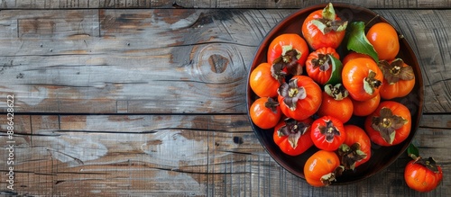 Bowl of autumn persimmons o...