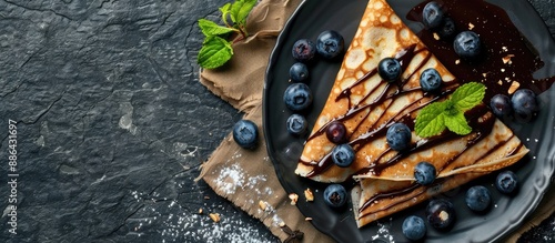 Chocolate crepes with blueb...