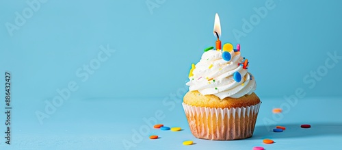 A birthday cupcake sits ato...