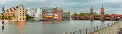 Old Berlin Oberbaum Bridge over the Spree River at sunset. photo