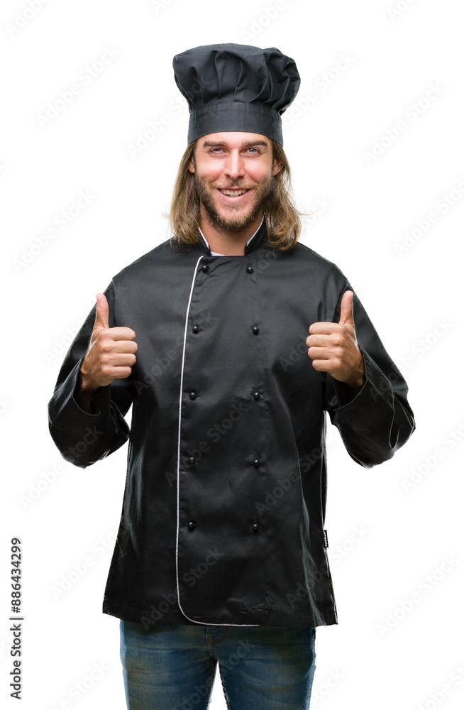 Young handsome cook man with long hair over isolated background success sign doing positive gesture with hand, thumbs up smiling and happy. Looking at the camera with cheerful expression. Young handsome cook man with long hair over isolated background success sign doing positive gesture with hand, thumbs up smiling and happy. Looking at the camera with cheerful expression.